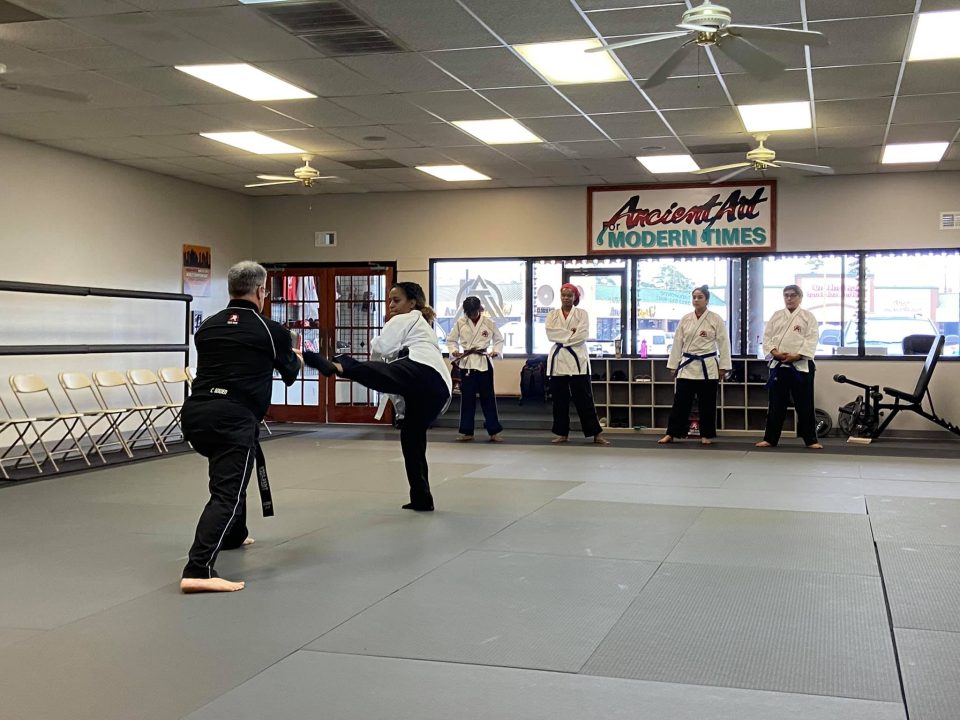 adult martial arts student in class